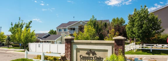 a subdivision sign in front of a house  at Country Oaks Apartments in Utah, 84015