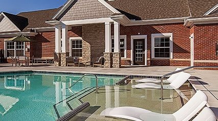 midtown pointe apartments outdoor pool with lounge tanning chairs