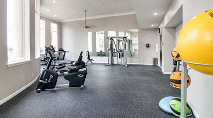 A gym with a yellow ball on the right side.