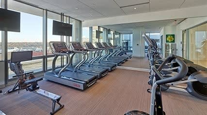 a room filled with lots of cardio equipment