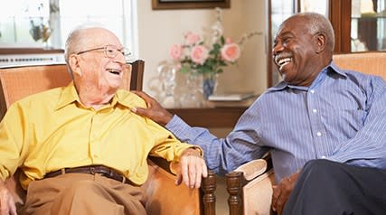 two elderly men talking