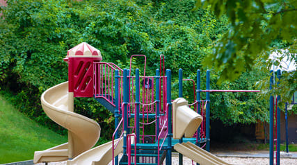 a colorful playground with a slide and other toys