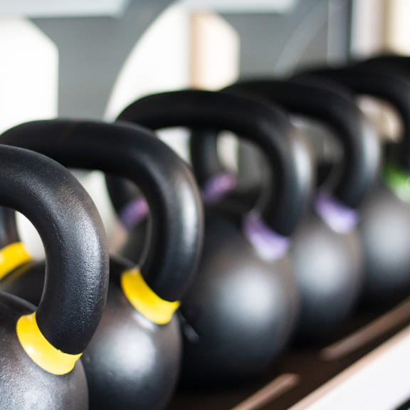 A Row of Kettlebells in a Gym at The Crossings at Redlands in Redlands 92374
