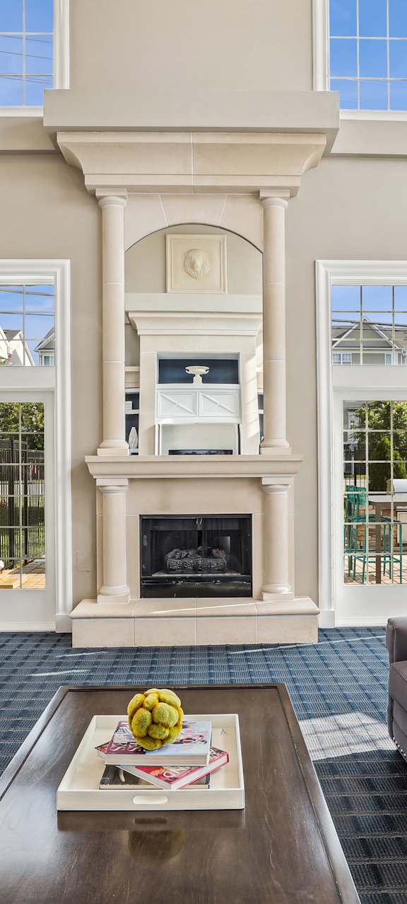 A house with a lit fireplace on the patio.