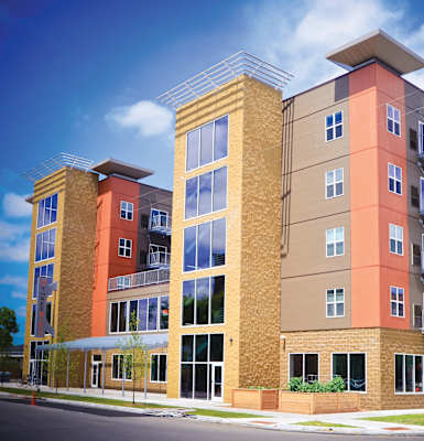 a rendering of an apartment building on a street corner