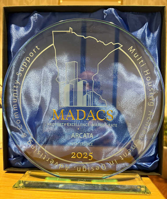 Glass plaque with MADACS written on it at Arcata Apartments, Minnesota, 55416