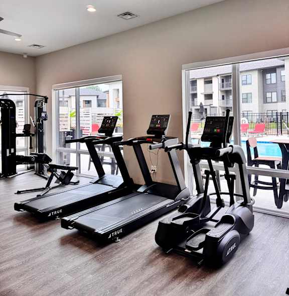 Man and woman exercising on treadmill at Artisan, O’Fallon, Illinois
