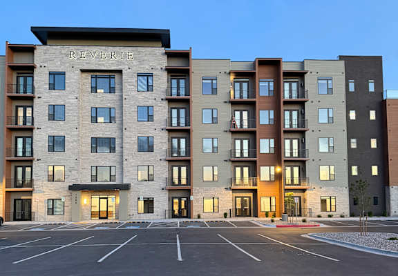 A tall building with the word "REVERE" on the bottom floor.