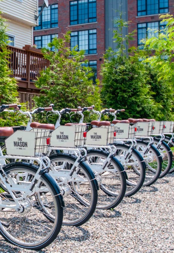 a row of bikes parked in front of a building