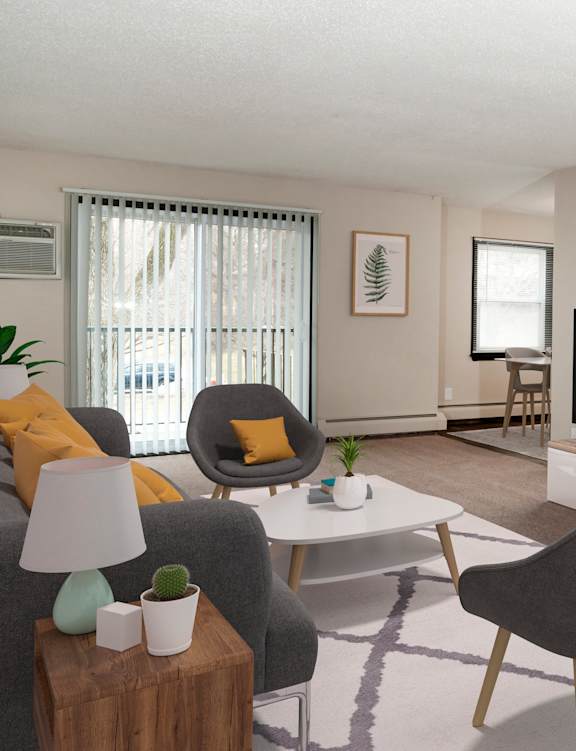 A living room with a grey chair and a white table.