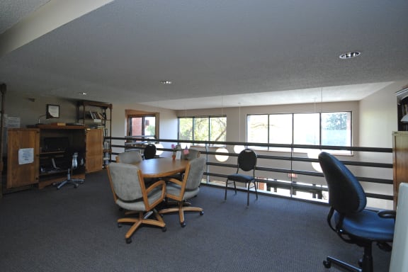 a room with a table and chairs