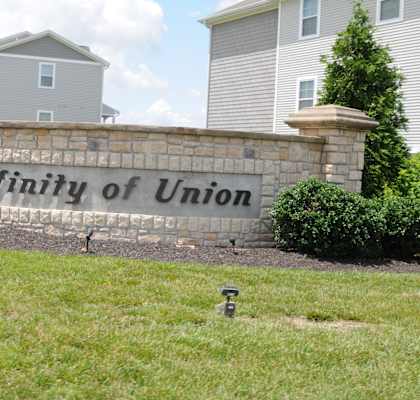 Affinity of Union sign in front of a building.