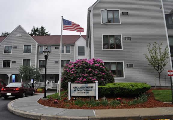 an flag flying in front of an apartment building