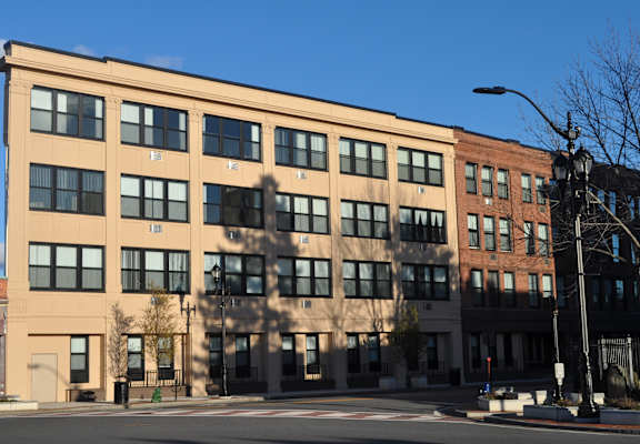 a large building on the corner of a city street
