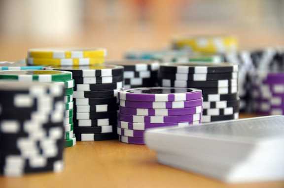 a pile of poker chips on a table