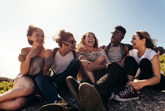 a group of young people sitting on the beach at Viceroy Apartments, North Carolina, 27707