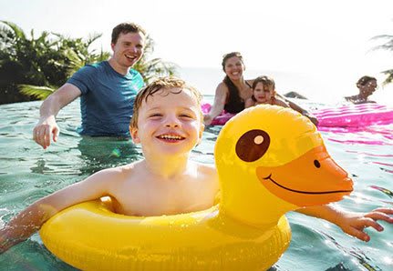 Family swimming in the pool