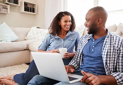 Couple sitting in living room