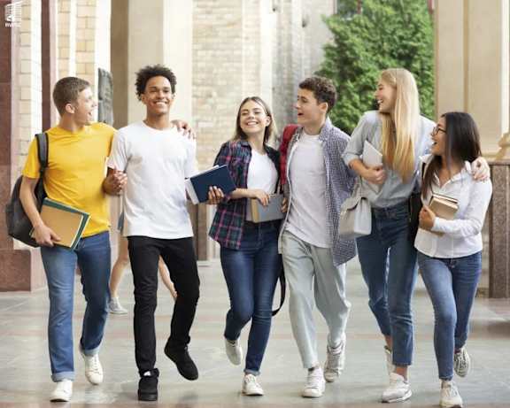 a group of students walking through a university hall at 430 Kelton, Los Angeles, CA