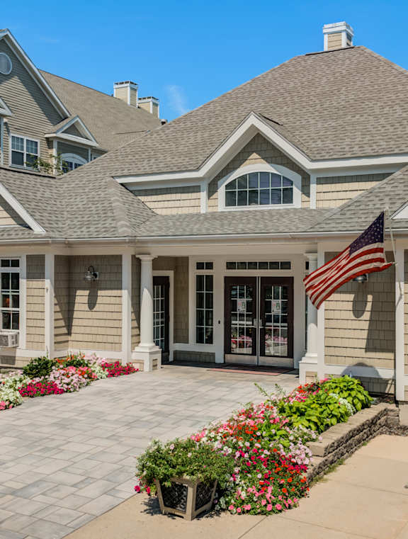 A house with a flag on the front porch.