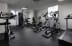 a room filled with lots of different types of exercise equipment