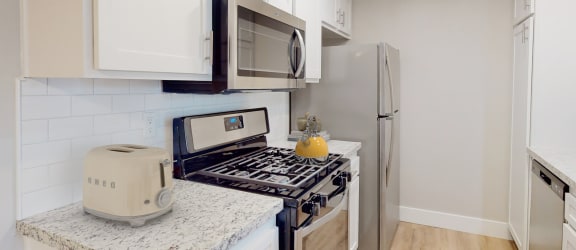 Artisan Oaks Kitchen with Stainless Appliances