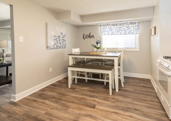 a kitchen with a dining table and a stove and a window at Fairbrook Park, Baltimore Maryland