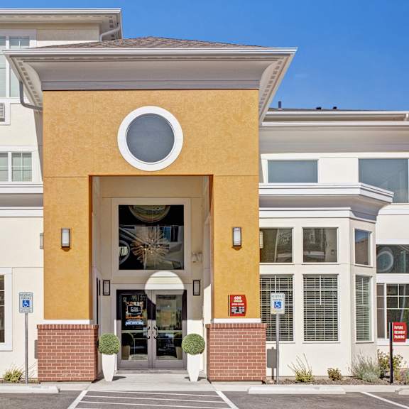 The front of the building at 600 Riverside, with a round window and other windows around it.