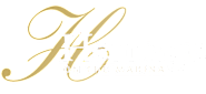 A logo with the words "Heritage on the Marina" written in a cursive font.