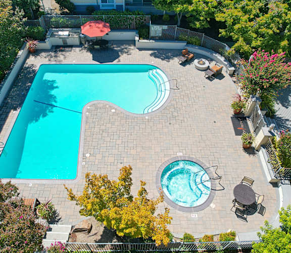 an aerial view of a backyard with a large swimming pool and a jacuzzi at The Retreat at Walnut Creek, Walnut Creek, CA, 94596