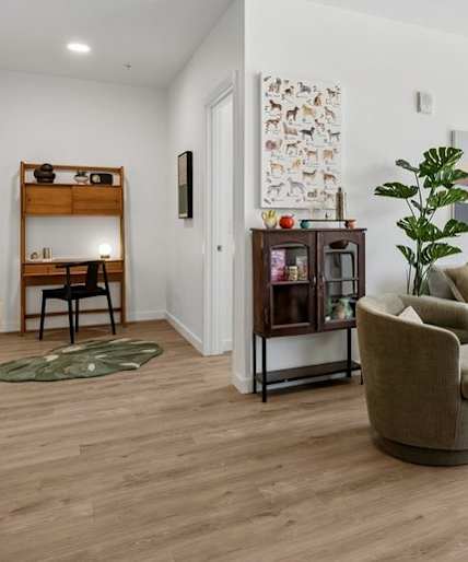 Modern kitchen with a large island and red chairs at Kinline, Beaverton, OR