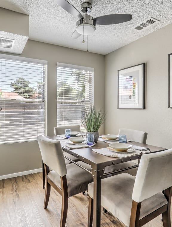 a large living room with a kitchen and a dining room