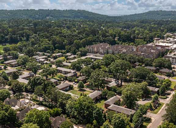 A bird's eye view of a residential area with houses and trees.