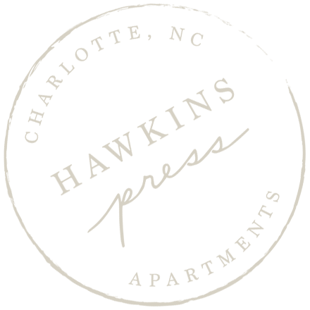 a tan background with a white border at Hawkins Press Apartments North Carolina
