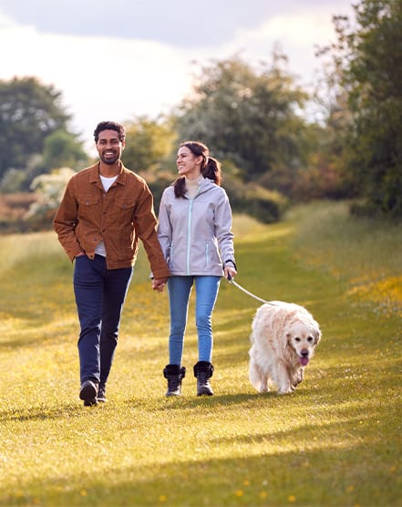 Couple Walking With Dog at The Quarters Apartments, Dock Road