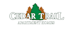 white lettering cedar trail apartment homes with green and brown trees behind the lettering