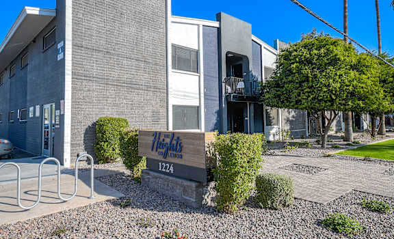 A building with a sign that says "Heights" and the number 1224.