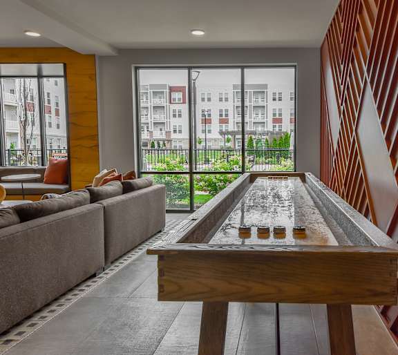 a living room with a couch and a table with chairs