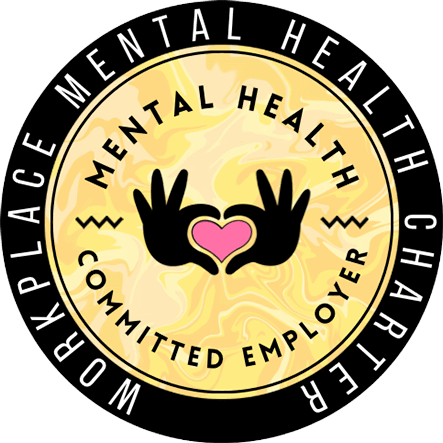 a yellow circle with a heart and two hands with a pink heart in the middle