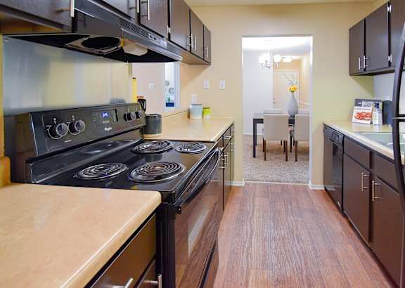 a home office with a desk and chair and a large window at Riverset Apartments, Memphis, 38103