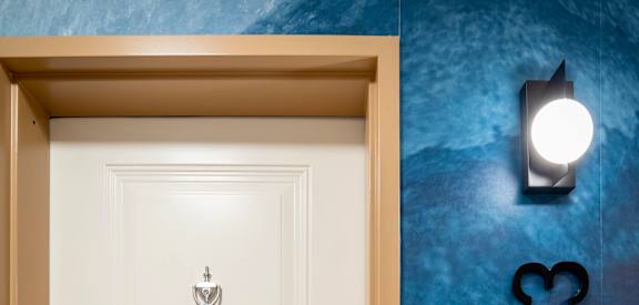 A white door with a number 313 on the wall behind it.