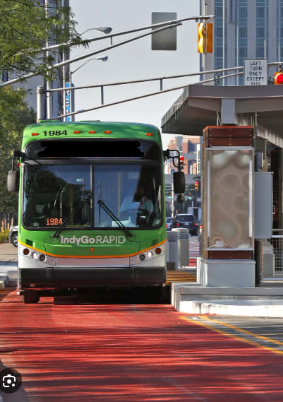 a bus stopped at a bus stop on a city street