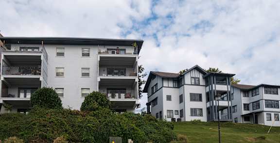 a row of apartment buildings on a hill