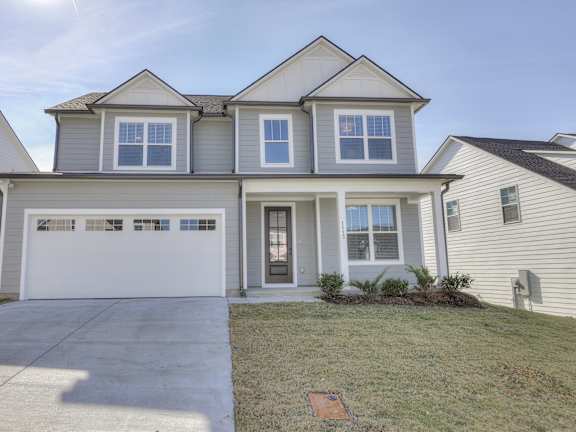 White house with a driveway at 1104 Residences, Tennessee, 37013