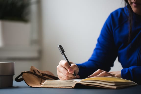 Person Writing at Cypress Meadows Senior Apartments, California, 93003