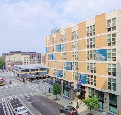 A modern building with a blue and yellow design on the side.
