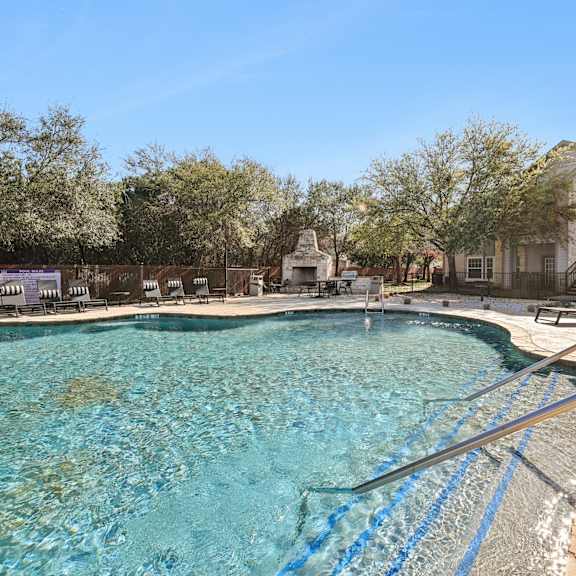 A large swimming pool with a blue line in the middle.