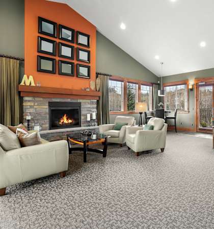 A living room with a fireplace and a couch.