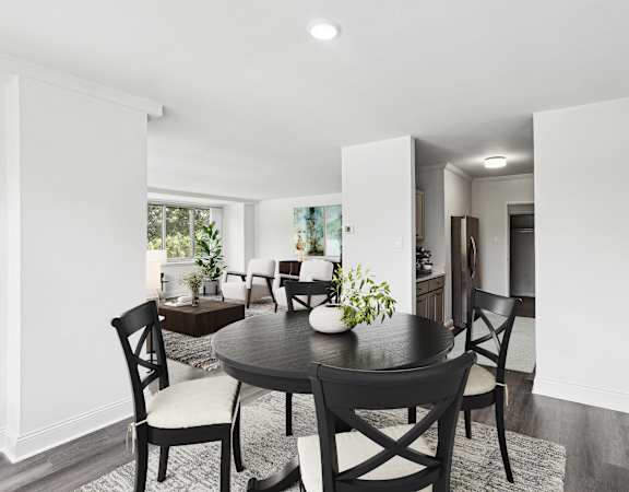 a dining room with a table and chairs