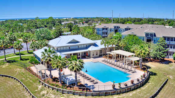 A large house with a pool in the backyard.